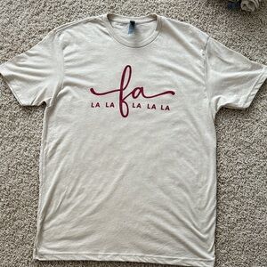 Next Level Apparel Beige Tee with Maroon Script